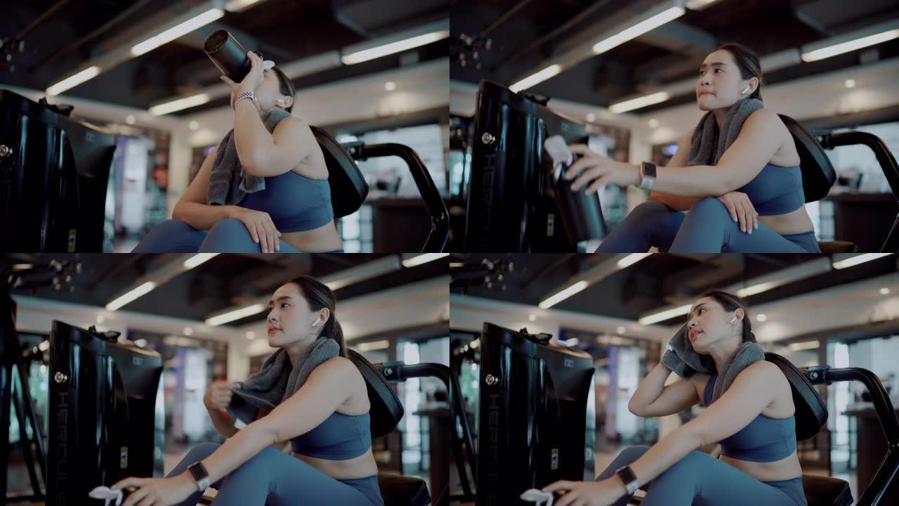 运动女子在健身房喝蛋白质奶昔