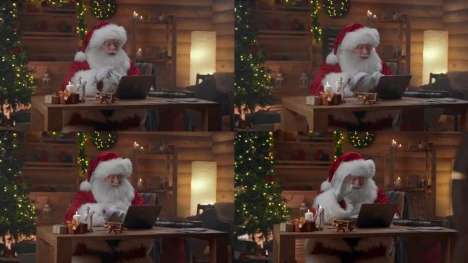 圣诞老人坐在他的办公室里，他完成了视频聊天并关闭了笔记本电脑