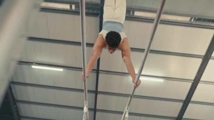 Young gymnast man training, acrobat skills on gymn