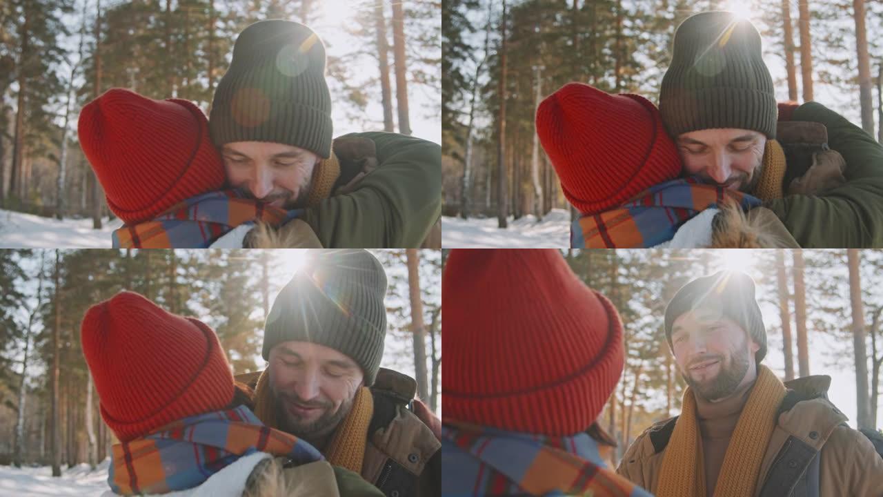 冬天在森林里拥抱的男人和女人