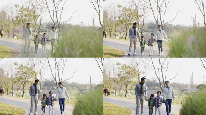 亚洲家庭在公园户外散步放松