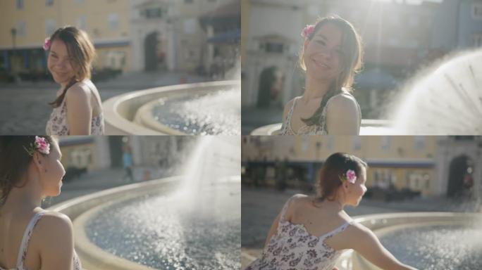 玩喷泉水的年轻女子