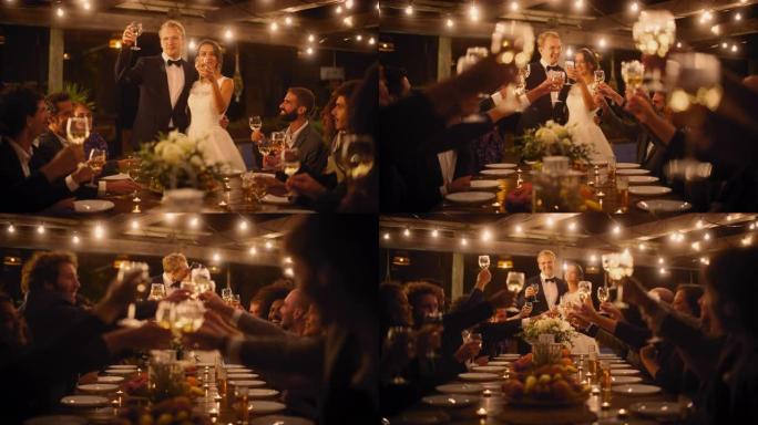 美丽的新娘和新郎在晚会上庆祝婚礼。新婚夫妇提议为幸福的婚姻干杯，与最好的多种族多元朋友站在餐桌旁。