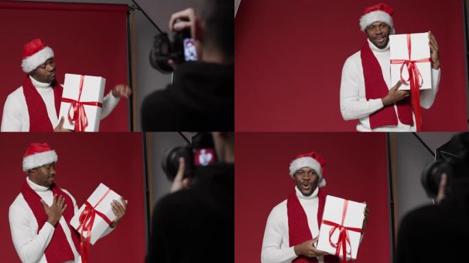 幕后拍摄一名戴着圣诞帽的黑人男子和盒装礼物