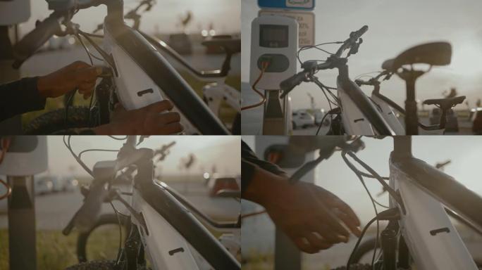 SLO MO无法识别的男人将电动自行车插在电动汽车充电站上