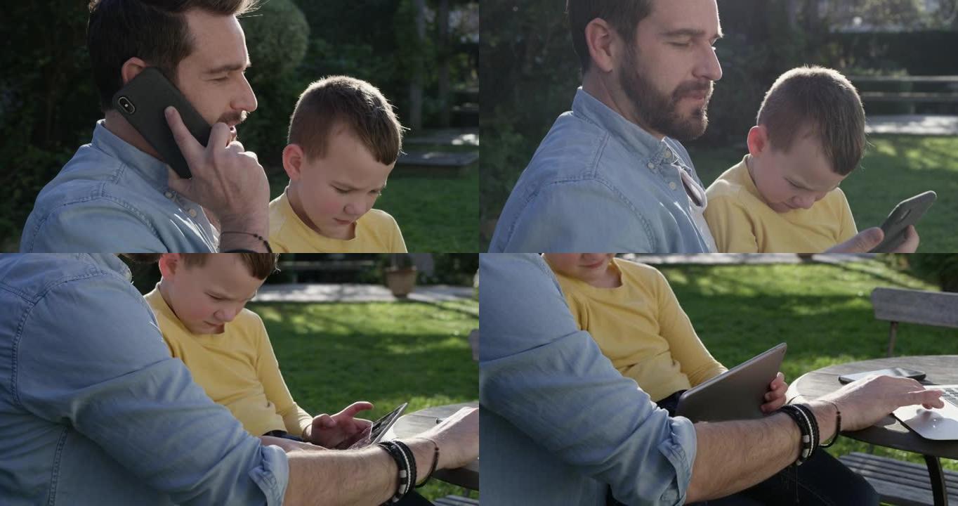 4k视频片段，一名男子坐在外面，儿子坐在腿上工作