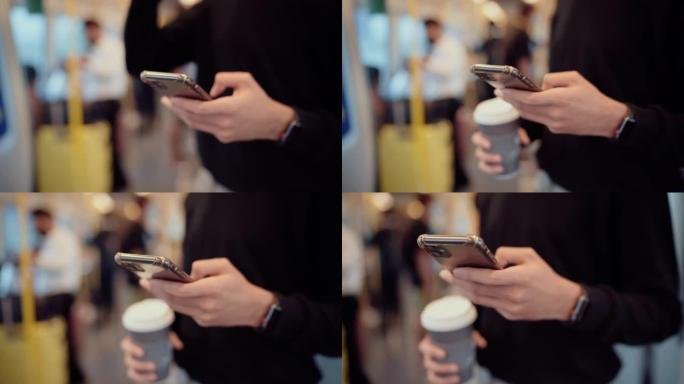 乘客在火车上使用智能手机和拿着咖啡杯