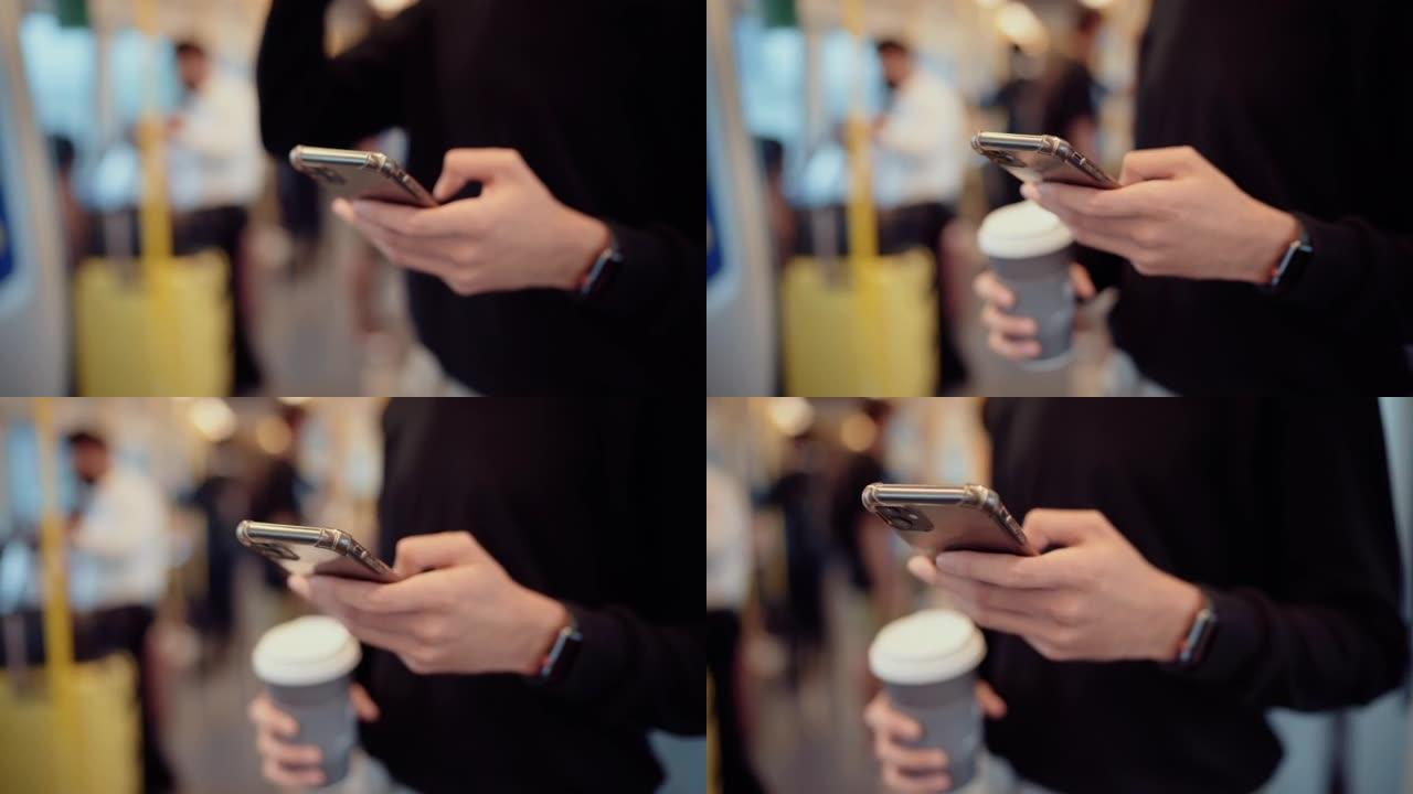 乘客在火车上使用智能手机和拿着咖啡杯
