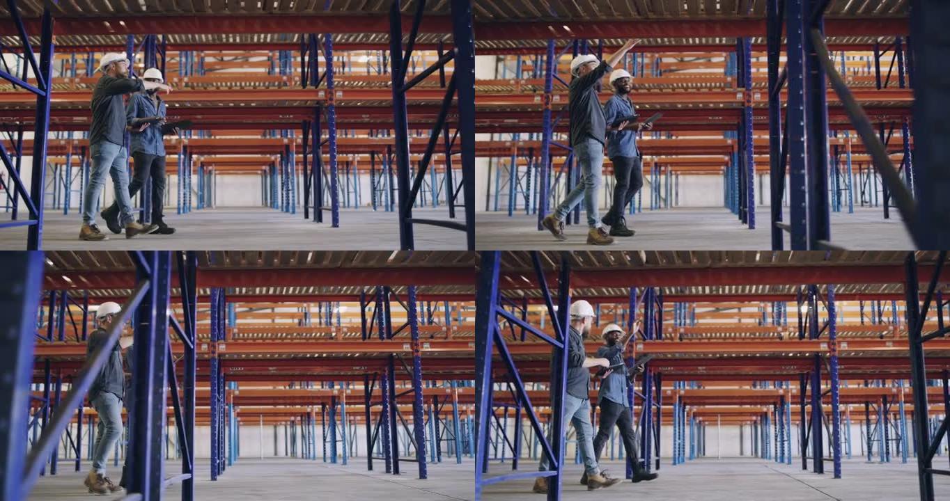 两名男子在建筑工地一起工作时使用数字平板电脑进行讨论的4k录像