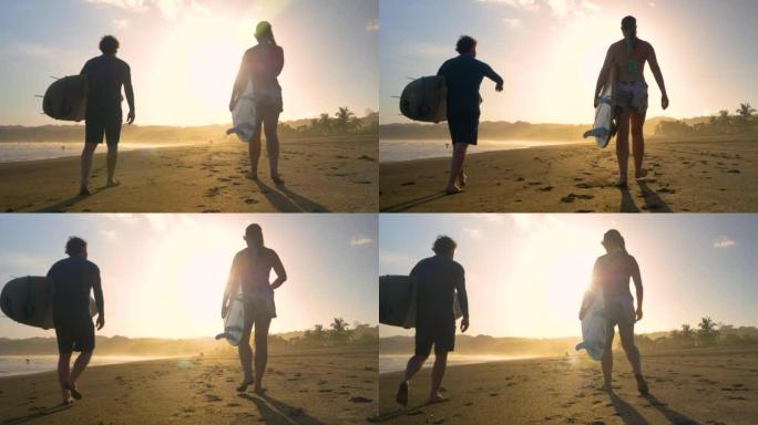 慢动作，低角度视图: 跟随冲浪者带着冲浪板在海滩上行走