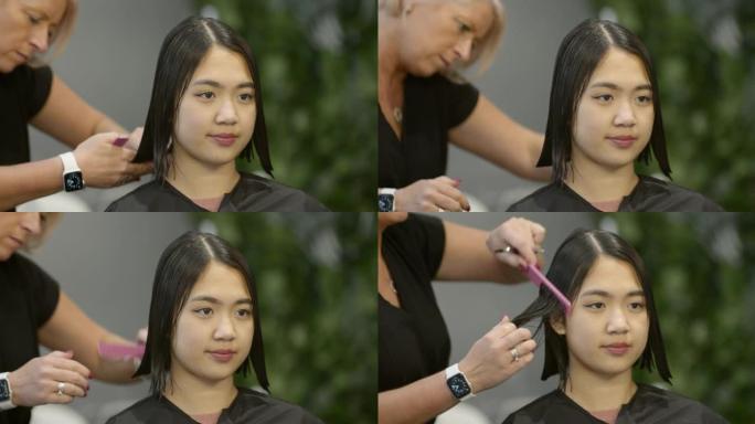 年轻女子剪头发女人打理美女女性发型设计
