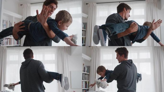 快乐爸爸抱着小男孩假装飞在家和爸爸玩好玩的游戏4k
