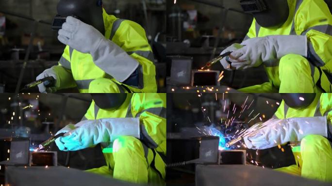 工厂工人用防护面罩焊接金属焊接钢结构。工厂和制造概念。