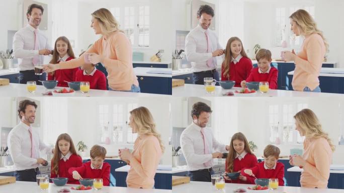 父母帮助穿着校服的孩子在厨房柜台吃早餐时做好准备