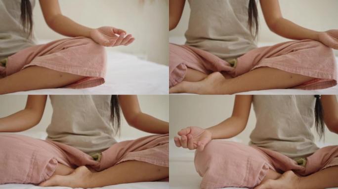 日本女性在床上莲花姿势冥想的B卷