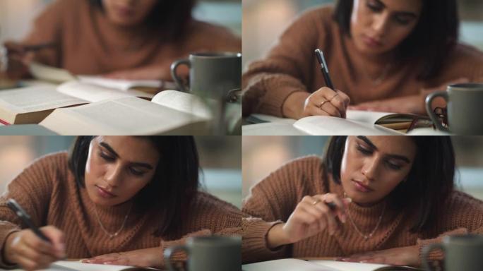 4k视频片段，一个迷人的年轻女子独自坐在家里，在学习时看起来很沉思