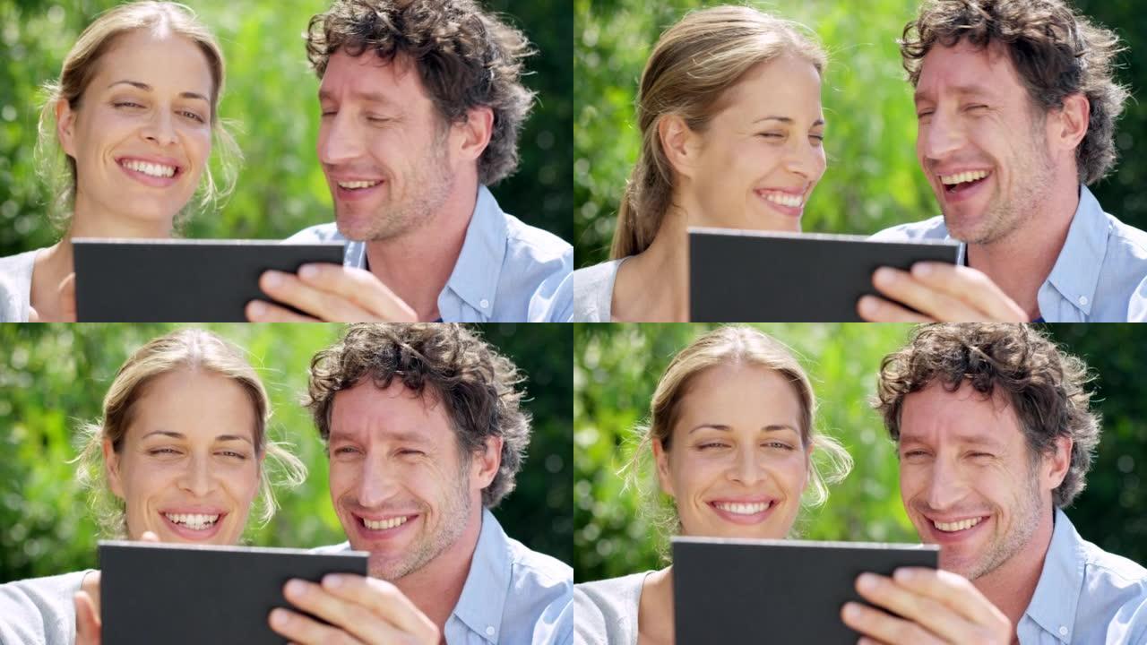 一对成熟夫妇在户外一起使用数字平板电脑的4k视频片段