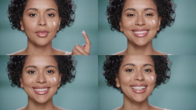 女性美女肖像。快乐的黑人多民族巴西妇女触摸自然，健康的皮肤，使用防晒霜，涂抹滋养面霜。孤立背景下的化