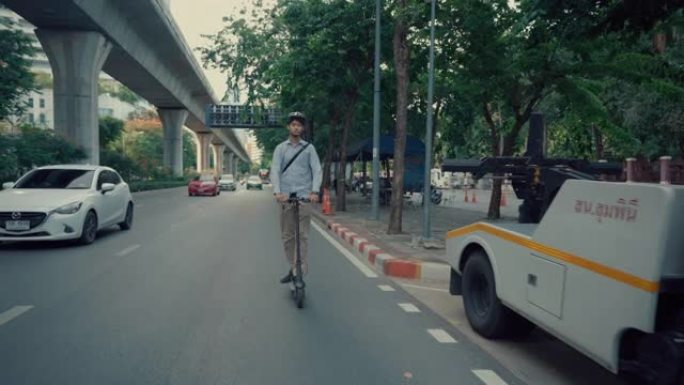 商人骑着踏板车去上班以帮助减少全球变暖