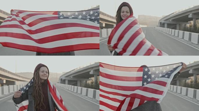 带着美国国旗的女人在高速公路上对着镜头微笑