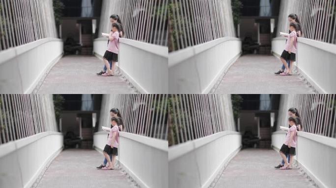 女孩在桥上读书老师小孩马尾