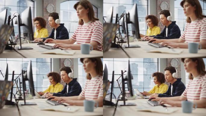 一群多民族的年轻创意同事坐在一起，在现代办公室里用电脑工作。混血儿女人在成功完成任务后微笑着。办公室