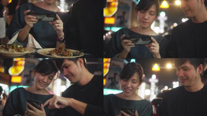 亚洲夫妇在街头美食约会。