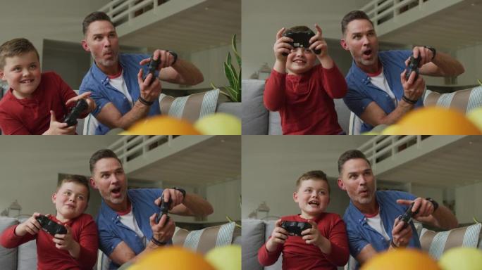 快乐的高加索父亲和儿子坐在客厅里玩电子游戏