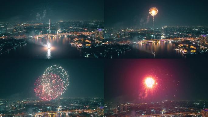 空中无人机视角多色烟花表演在天空之城。除夕。摩天大楼和城市景观庆祝夜晚的灯光