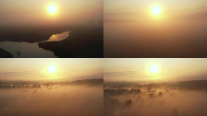 无人机在神秘的田野和蜿蜒的河流上飞过浓雾，升起以揭示史诗般的升起的太阳谷全景
