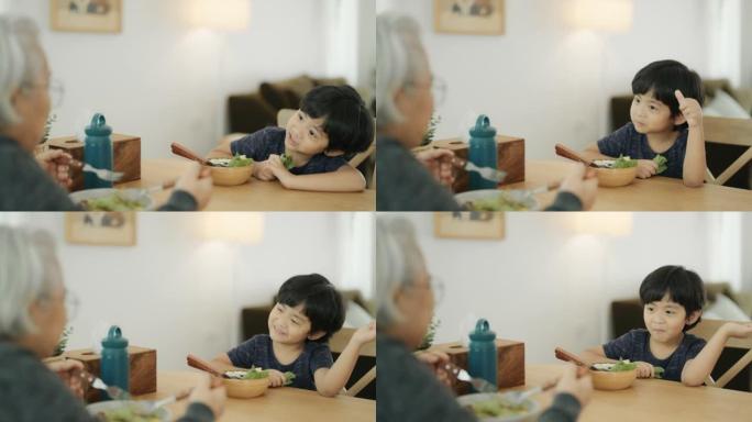 男孩和祖母喜欢吃饭。