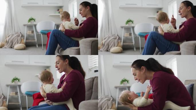 白人母亲在家里和婴儿坐在沙发上玩耍时吹哨子