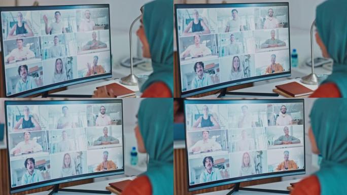 企业穆斯林妇女，在办公室用电脑，微笑和在线交流进行挥手和视频通话。伊斯兰crm专家，pc和waves