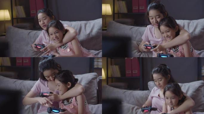 4k分辨率迷人的亚洲兄弟姐妹女孩一起玩电子游戏，并为自己在家里的客厅获胜感到高兴。两个姐姐在家时使用