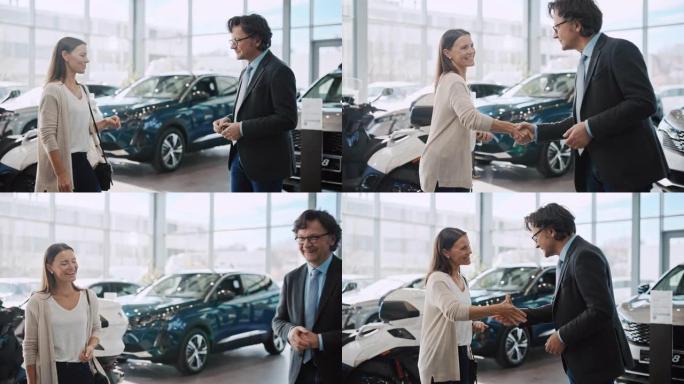 SLO MO汽车推销员将新车的钥匙交给了女顾客
