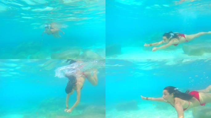4k视频片段，一位迷人的年轻女子在意大利度假期间在海洋中游泳