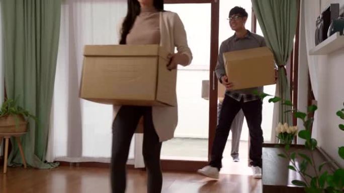 4K UHD多莉镜头: 快乐的亚洲多代家庭搬到新家公寓。移动日概念。