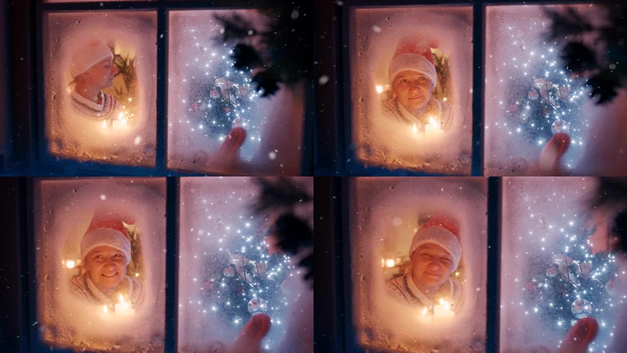 SLO MO幸福的女人在下雪的圣诞节之夜透过窗户看