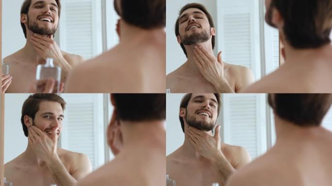 微笑打扮的男人在胡须上涂抹剃须后的保湿乳液。