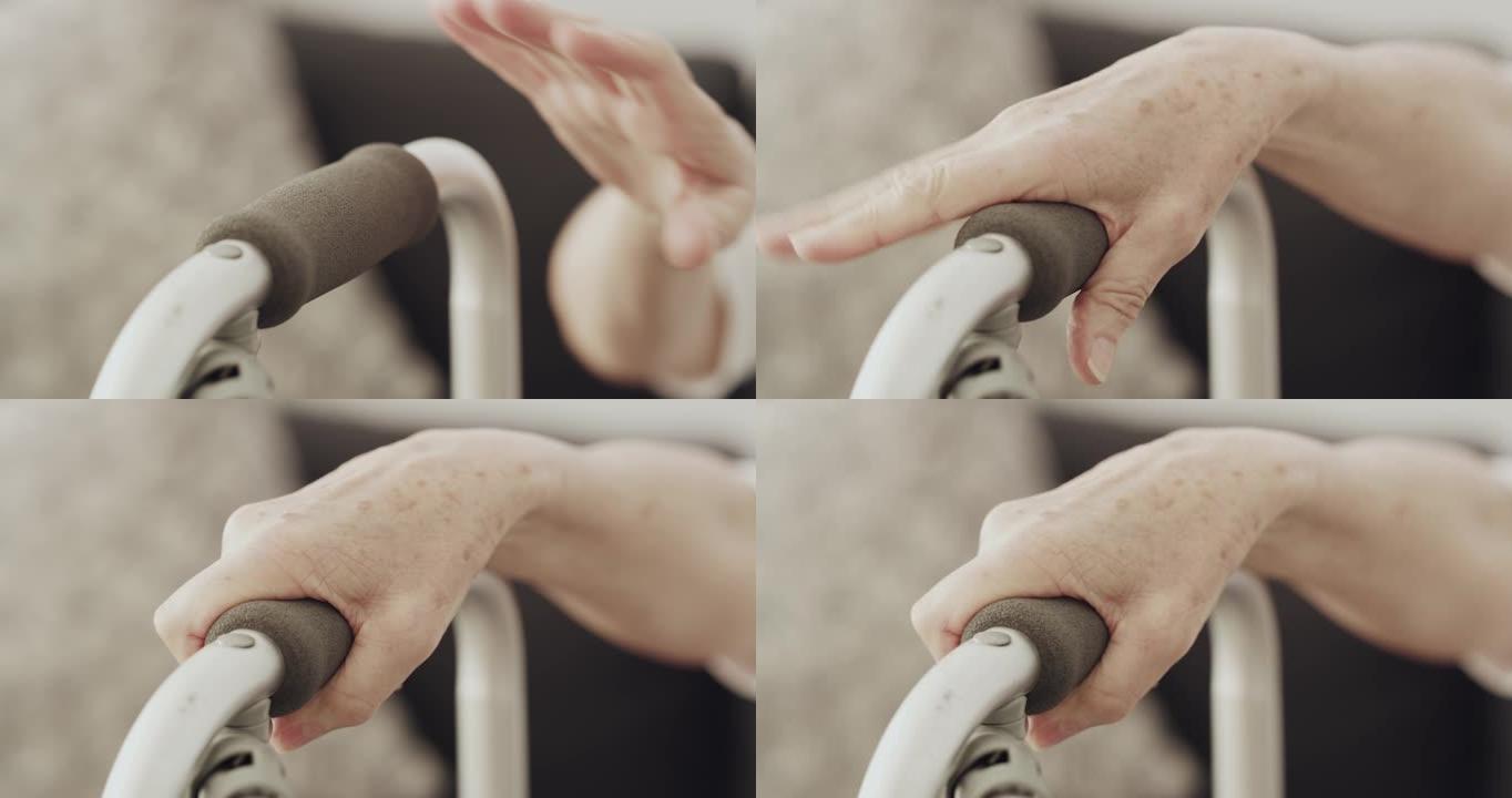 4k视频录像一位匿名的老年妇女抓住她的步行框架以提供支撑