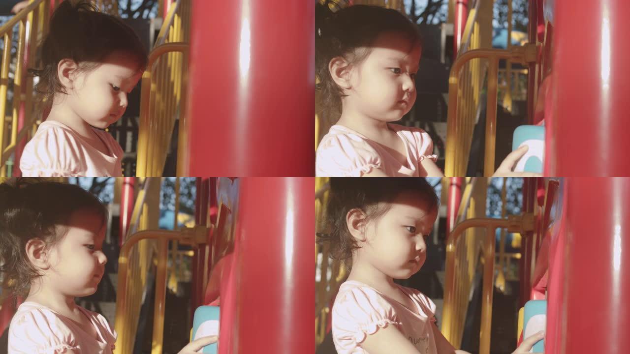 特写亚洲幼儿2年夏天和她的祖父和祖母在公园玩玩具