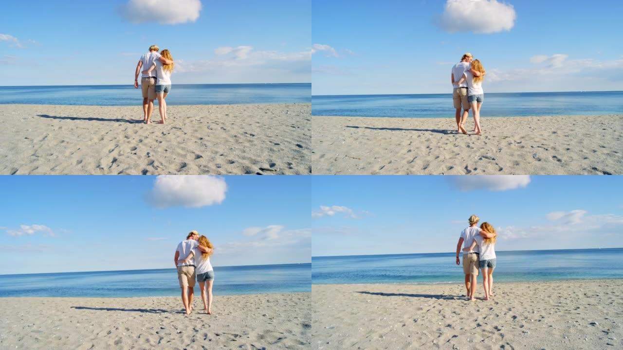 一对夫妇在海滩上共度时光的4k视频片段
