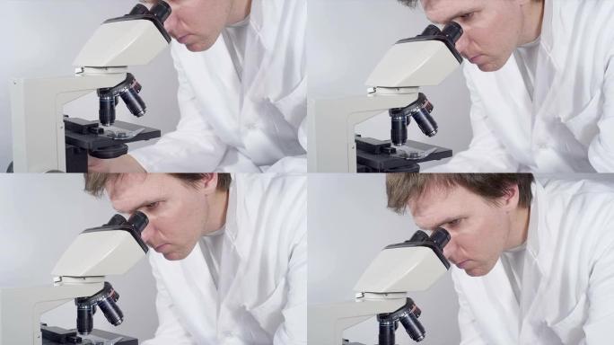 特写: 医学学生使用显微镜