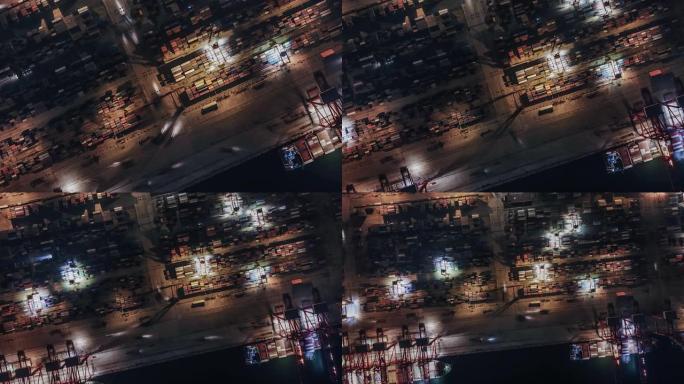 夜间集装箱运输繁忙工业港口的T/L无人机视图