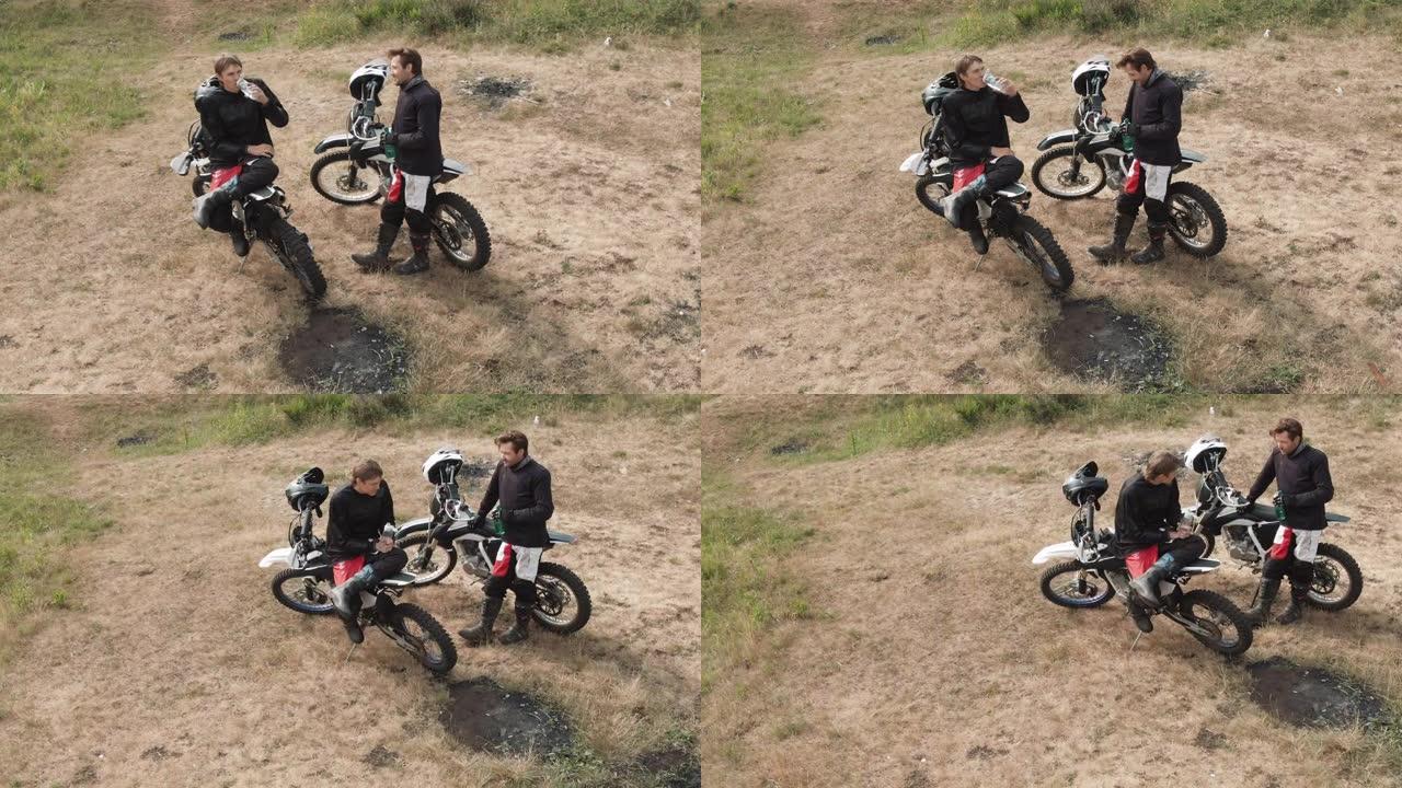摩托车手聊天和休息的无人机镜头