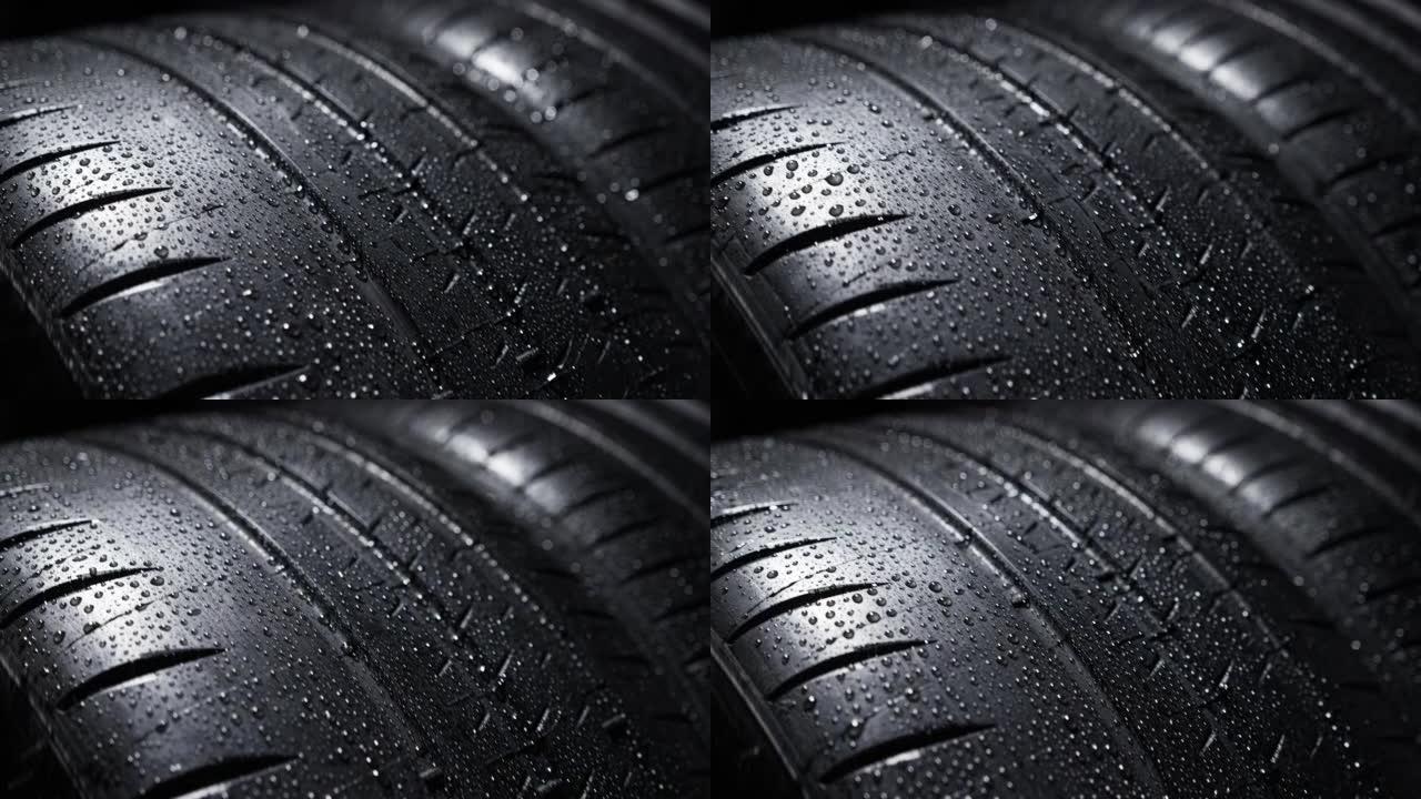 湿现代高性能运动夏季轮胎旋转，隔离在黑色背景上