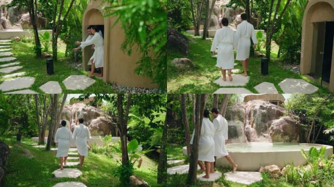 夫妇牵着浴袍走过院子