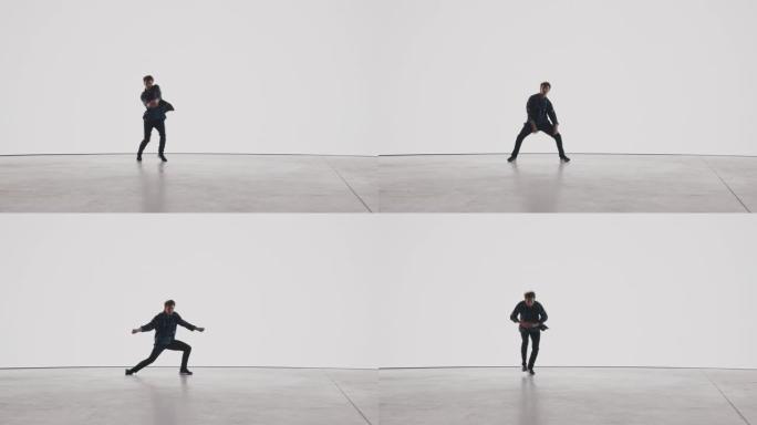 在工作室环境中的虚拟制作过程中，时尚的专业男舞者在白色背景的大Led墙壁屏幕前表演嘻哈舞蹈套路。
