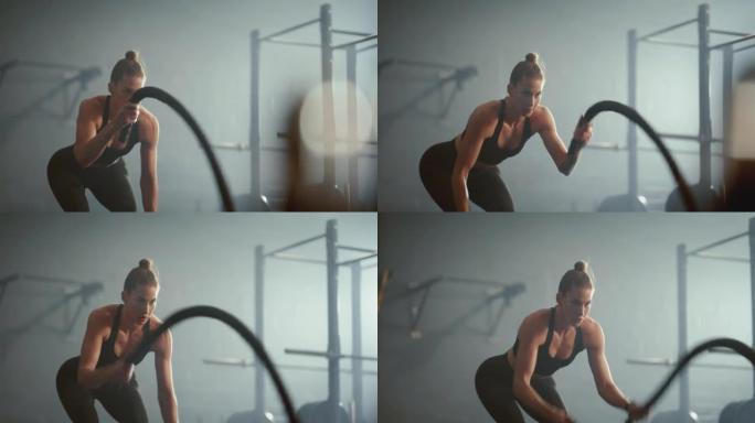 锻炼，健身和战斗绳索与运动女子在健身房用重型设备训练锻炼。健康，健康和有氧运动，强壮的女运动员在运动