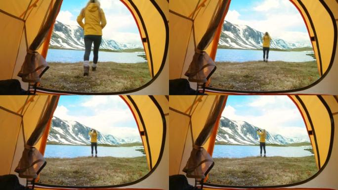 4k视频片段，一个无法识别的女人站着并用手机拍摄m ø reog Romsdal的湖